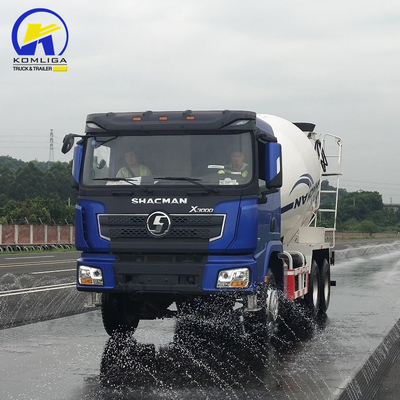 Shacman 6X4 camión mezclador de hormigón con rendimiento y levantamiento hidráulico de volante ventral