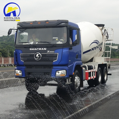 Shacman 6X4 camión mezclador de hormigón con rendimiento y levantamiento hidráulico de volante ventral